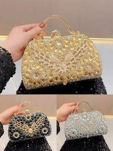 Detail of crystal butterfly evening bag showing shiny rhinestones in gold, black and silver
