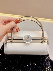 Elegant white evening clutch bag with large crystal clasp and silver metal handles