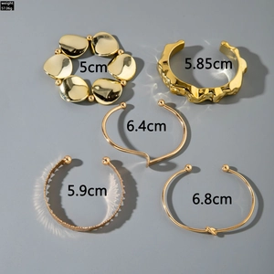 Five-piece set of gold geometric metal bracelets featuring knot and wavy texture designs