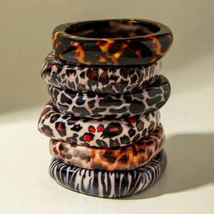 Set of six chunky resin bangles with assorted leopard and animal print patterns