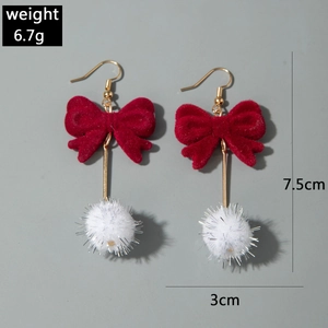 Detail shot of winter bow earrings with white fur balls showing 7.5cm length measurement