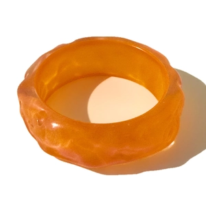 Chic orange resin irregular wave bangle with glitter finish and mermaid water ripple effect