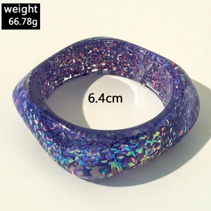 Macro shot of purple resin bangle showing 6.4cm inner diameter and 66.78g weight