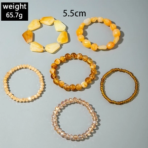 Bohemian multi-layer beaded bracelet set featuring amber resin and irregular yellow beads