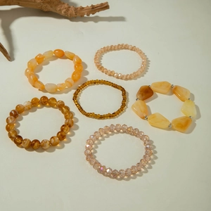 Bohemian multi-layer beaded bracelet set with amber-toned crystals and irregular stones