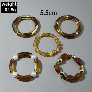 Detail shot of multi-layered amber resin bracelets with gold beads and pearls, 84.8g
