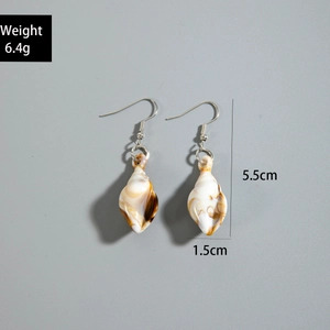 Detail of shell earrings showing marble texture and 5.5cm height with weight 6.4g