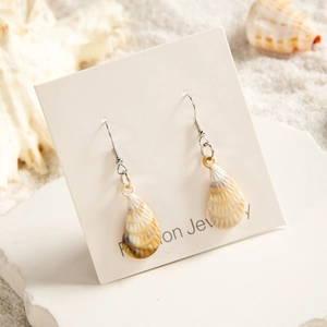 Summer beach style shell drop earrings with acrylic starfish and metal hooks on display card