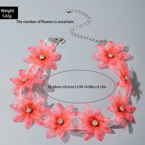 Macro shot of pink mesh flower choker with size and weight details on gray background