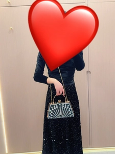 Fashionable black evening clutch bag with sparkling fan-shaped rhinestones and gold chain