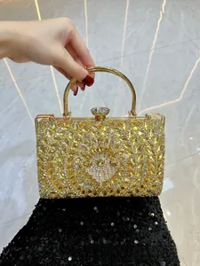 Detailed macro of crystal evening bag with yellow rhinestones and gold round handle