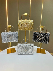 Exquisite evening clutches in gold, silver, black, and white with radiant crystal floral patterns