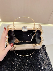 Champagne gold evening clutch with rhinestone clasp, metal ring handle and chain strap
