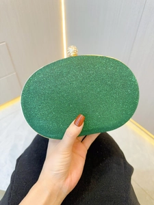Elegant emerald green glitter clutch evening bag with a crystal sphere clasp for women