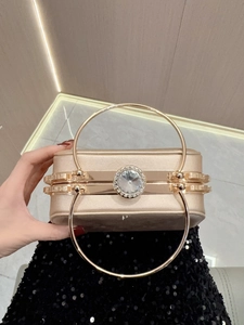 Elegant champagne gold satin evening clutch with large rhinestone and round metal handles