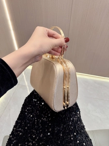 Elegant gold rhinestone evening clutch bag with circular metal handle for formal gala