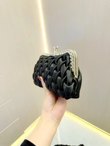 Elegant black satin evening clutch bag with woven texture and sparkling rhinestone frame