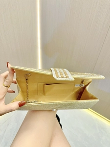 Detail of gold sequin clutch interior with chain strap and card slot for formal events