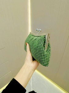 Luxurious green rhinestone clutch bag with silver metal frame for elegant evening parties