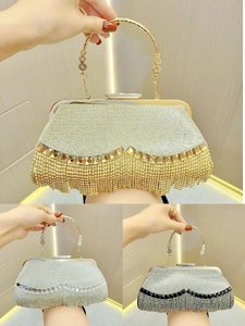 Close-up of tassel rhinestone evening bag in gold, silver, and black white finishes