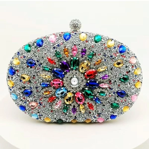 Luxury oval evening clutch with silver rhinestones and colorful pear-shaped gemstones