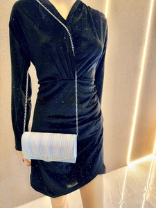 Elegant white pleated evening clutch bag with rhinestone trim and silver chain strap