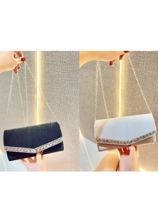 Elegant pleated evening clutch bag with V-shaped rhinestone detail and chain strap