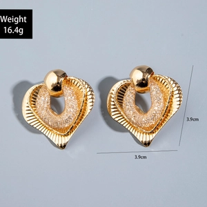 Detailed view of large golden heart earrings with dimensions and weight data