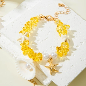 Bracelet en perles de coquillage avec pierres ambrées et perles style plage