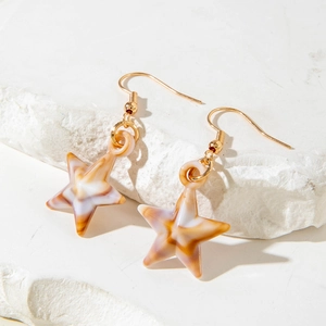 Star-shaped acrylic drop earrings with gold hooks and marble texture for beach style