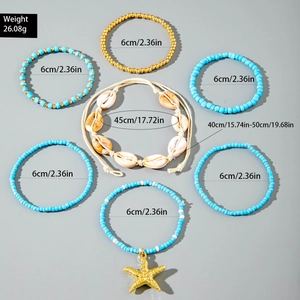 Detail of 7-piece bohemian jewelry set with sea shells and starfish charms