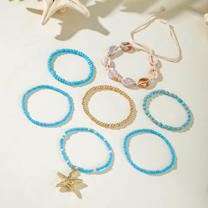 Detail of 7pcs Bohemian beach bracelets set with starfish charms and natural seashells