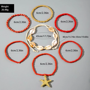 Detail view of 7-piece boho ocean jewelry set with red beads, starfish charm and shell necklace