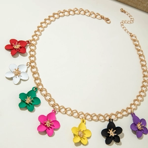 Macro detail of multi-colored flower pendant necklace with golden metal lobster clasp