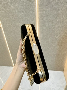 Elegant black velvet clutch with gold frame and crystal rhinestone strap for women