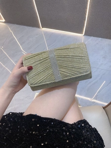 Champagne gold glitter evening clutch bag with five rows of vertical rhinestones