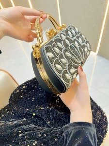 Elegant floral rhinestone evening clutch with pearl accents and gold handle for formal gala