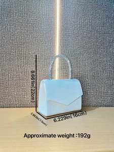 Light blue velvet evening bag with rhinestone handle and envelope flap design