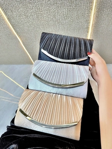 Elegant pleated silk clutch bags for women in black, silver, and champagne gold colors