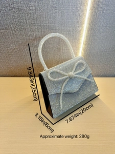 Sparkling silver rhinestone evening bag with bow detail and metal handle 20x25x8cm