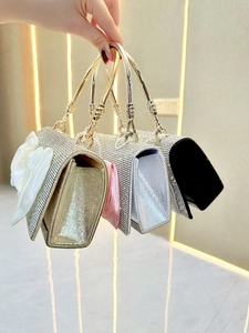 Chic rhinestone evening clutch bags with oversized satin bows and metal circular handles