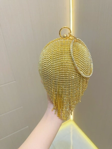 Elegant gold spherical evening clutch with sparkling rhinestones and crystal fringe tassels