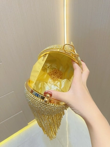 Gold rhinestone evening clutch with tassel fringe and chain strap for parties