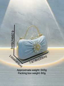 Elegant light blue evening clutch with radial rhinestone floral ornament and gold handle