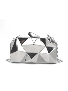 Detail of silver geometric acrylic evening clutch with 3D diamond cut and chain strap
