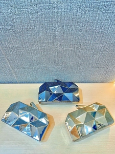 Geometric acrylic evening clutch bag with faceted diamond design and glossy metallic finish