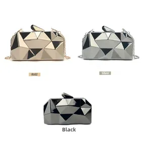 Close-up of geometric acrylic evening clutches in gold, silver, and black with metal chains