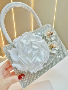 Sparkling silver rhinestone evening bag with large white silk flower and pearls