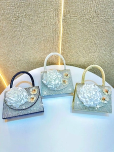 Luxurious evening clutch bag with crystal rhinestones and large 3D satin rose detail