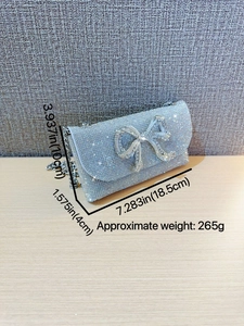 Elegant silver rhinestone evening clutch with crystal bow and metal chain strap
